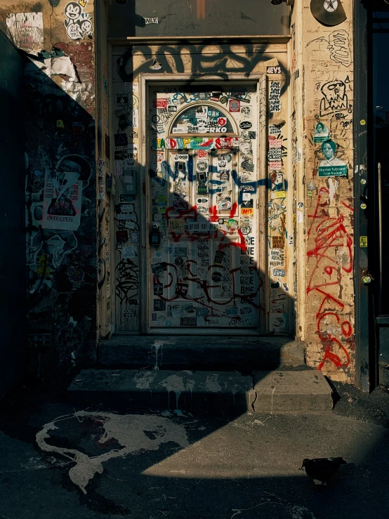 graffiti on a building and door to another building