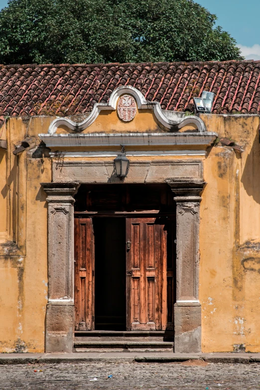 a clock sitting on top of an old building with a sky background