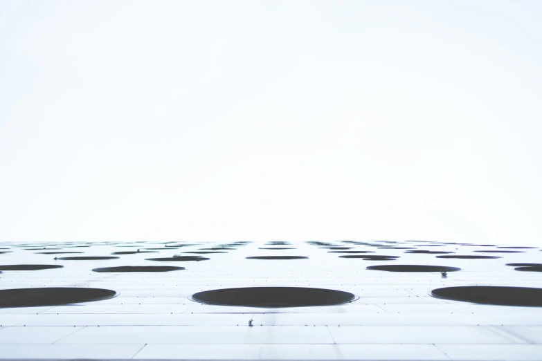 the view of the top of a building from below