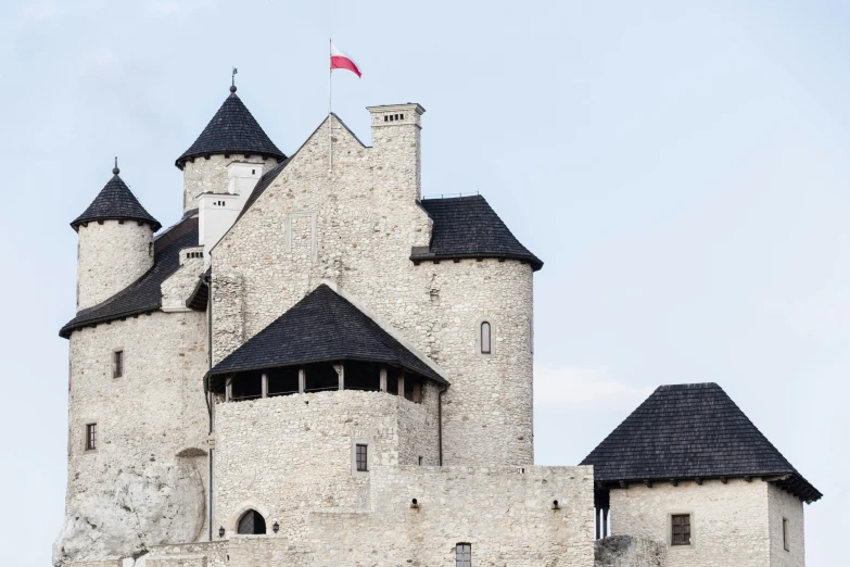 an old castle with a flag on top