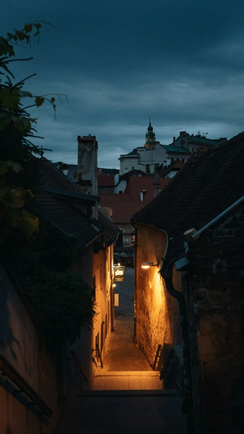 narrow alleyway with lamp lighting at night