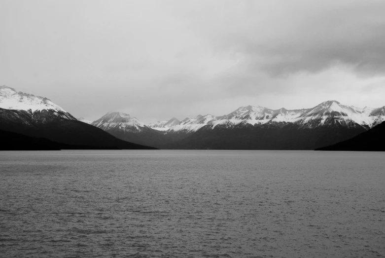 a black and white po of the mountains in the distance