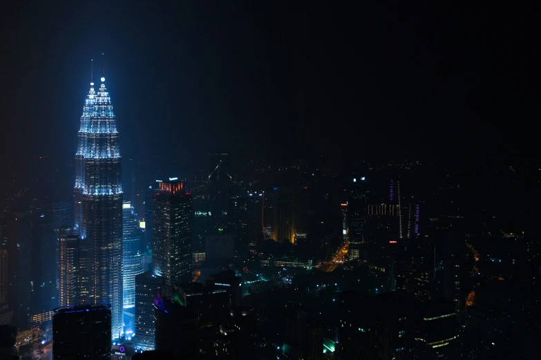 the view of a tall building from the top of the building