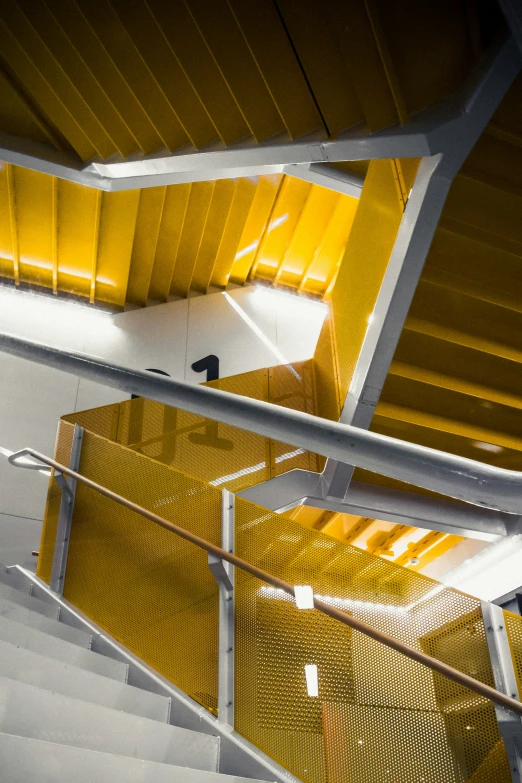 an overhead view of a yellow steel staircase