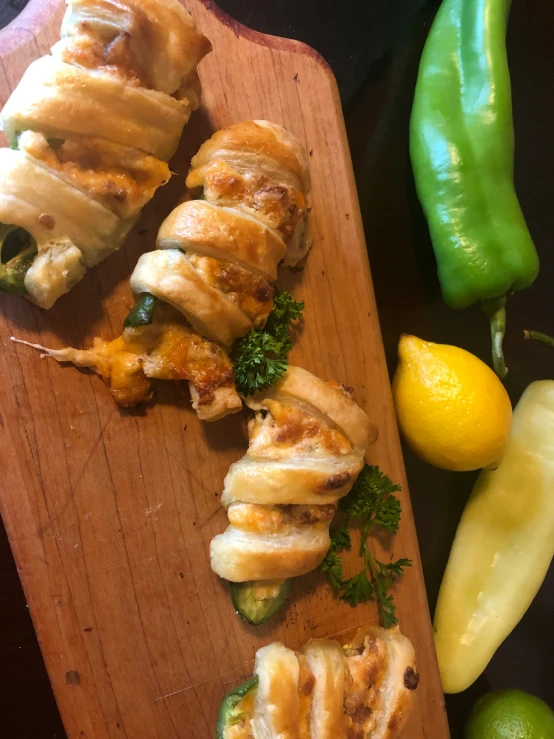 food items displayed on wood board with knife