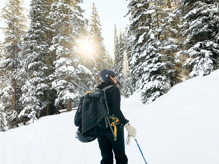 a person riding skis on a snowy surface