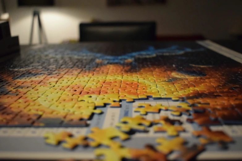 a large puzzle board covered in yellow pieces