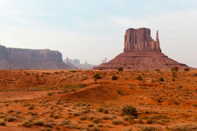 this is the view from a distance of a rocky desert with tall mountains