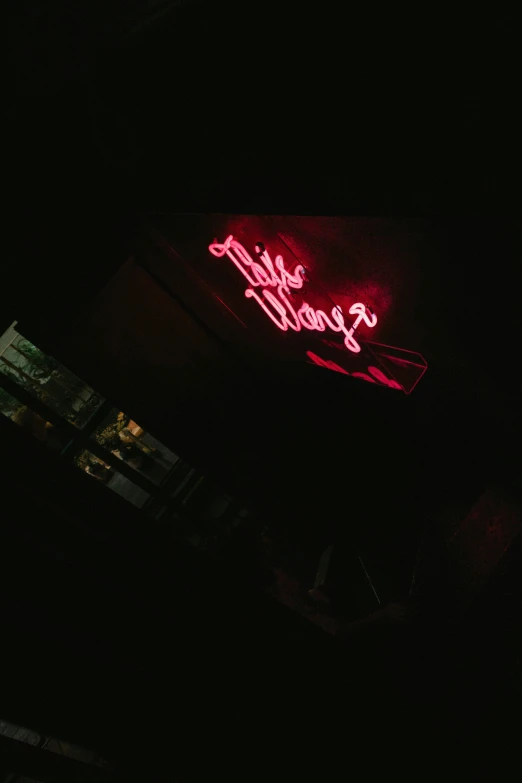 the neon sign is bright red for all to see