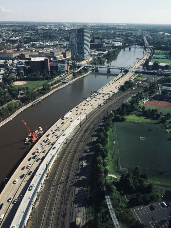 an aerial s shows a section of highway with lanes and street lights