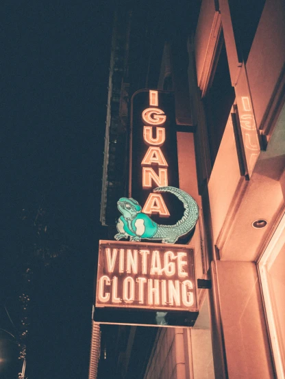 a street sign for a vintage clothing store