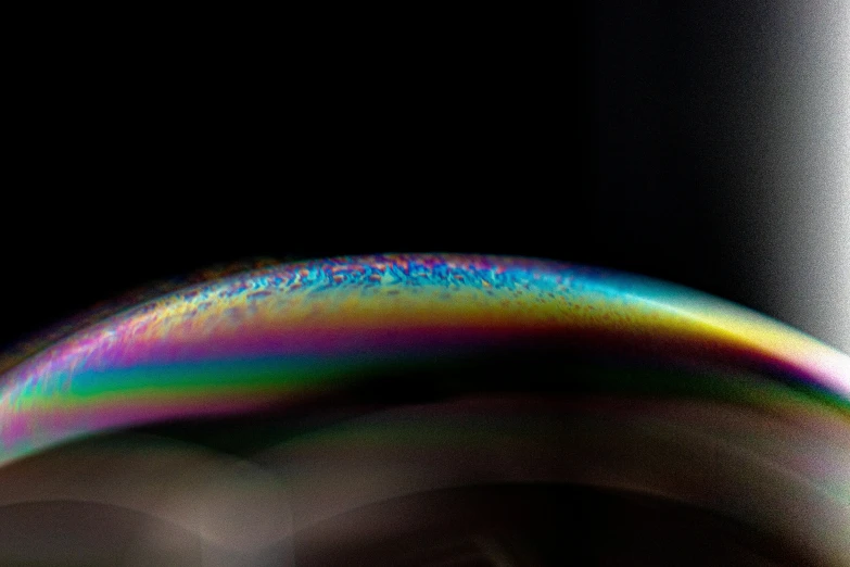 an abstract rainbow of light coming out of the back of a banana