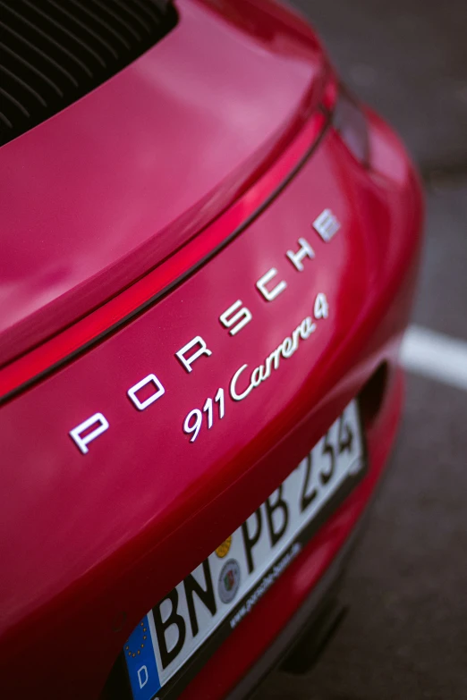 a porsche logo on the rear of a car