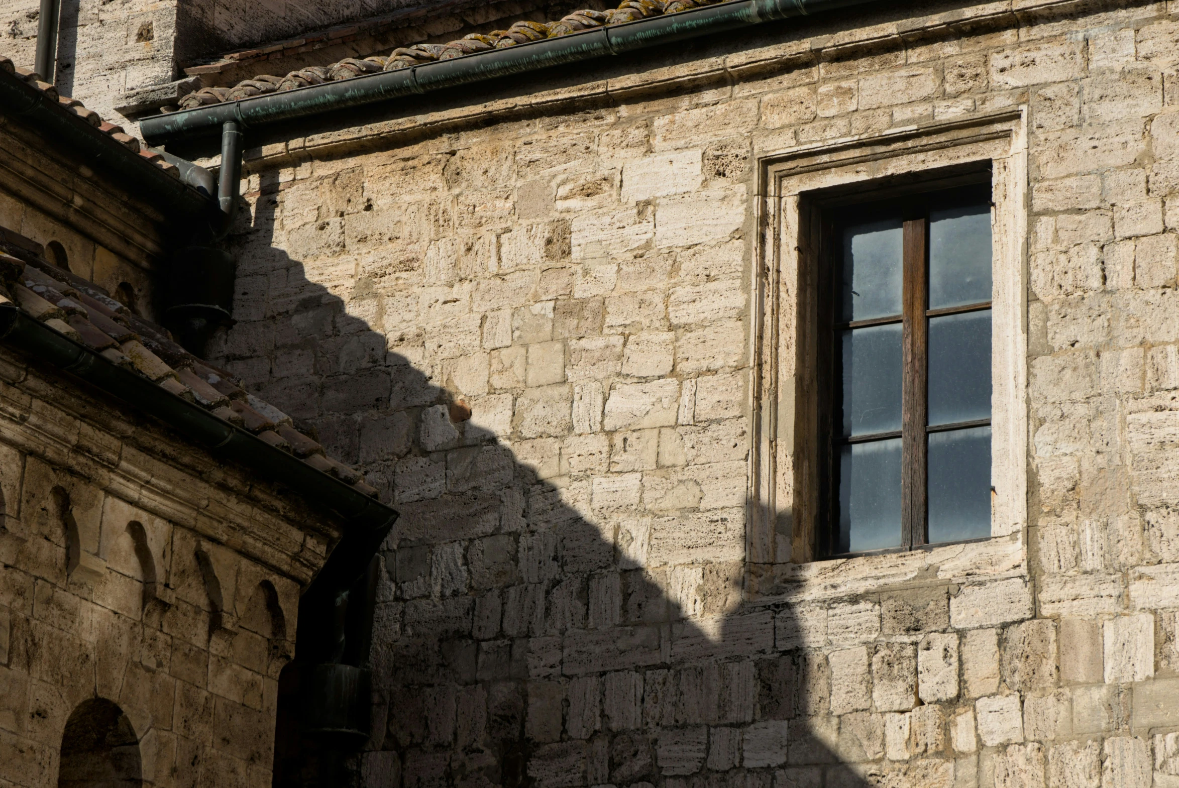 a window with a skylight in an old building