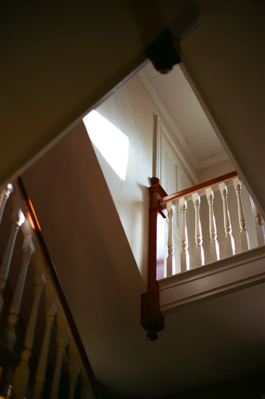 a stairwell railing seen from below the stairs