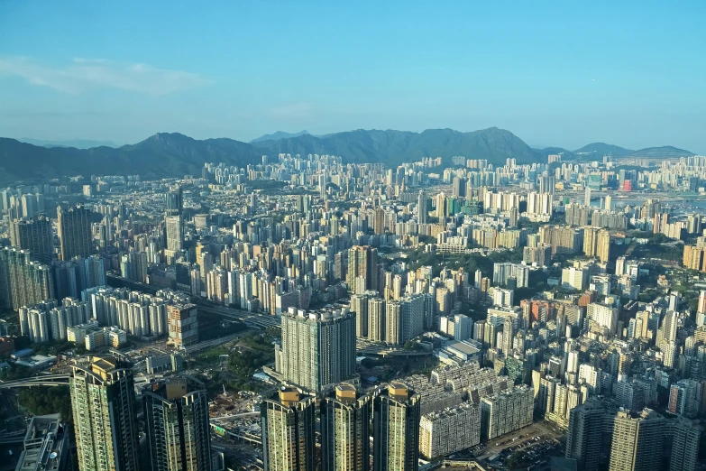 large and tall buildings and hills in a city