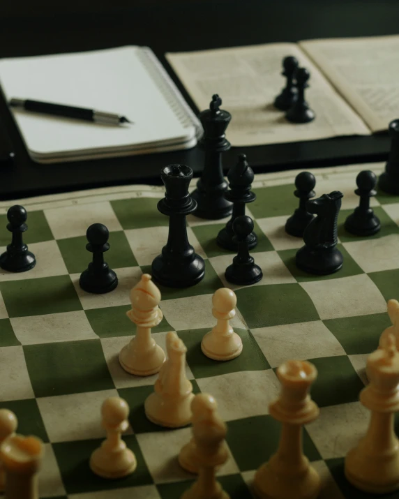 a game set up with chess pieces on top of it