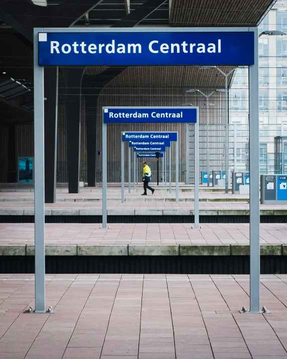 a blue sign in a station indicating the area where there is no other sign