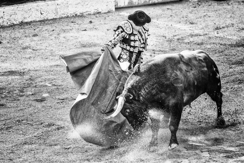 a person that is falling off of a bull