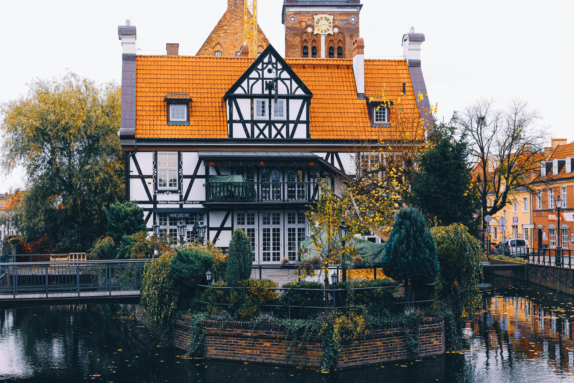 an old style house with a red roof