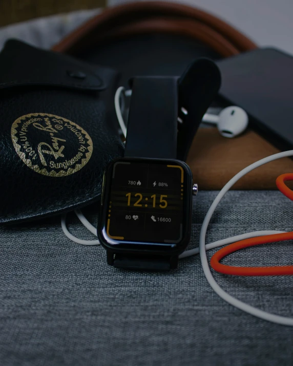 an apple watch with some kind of accessories around it