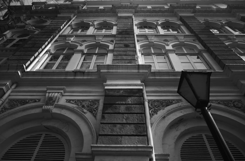 the bottom view of an old building with window frames