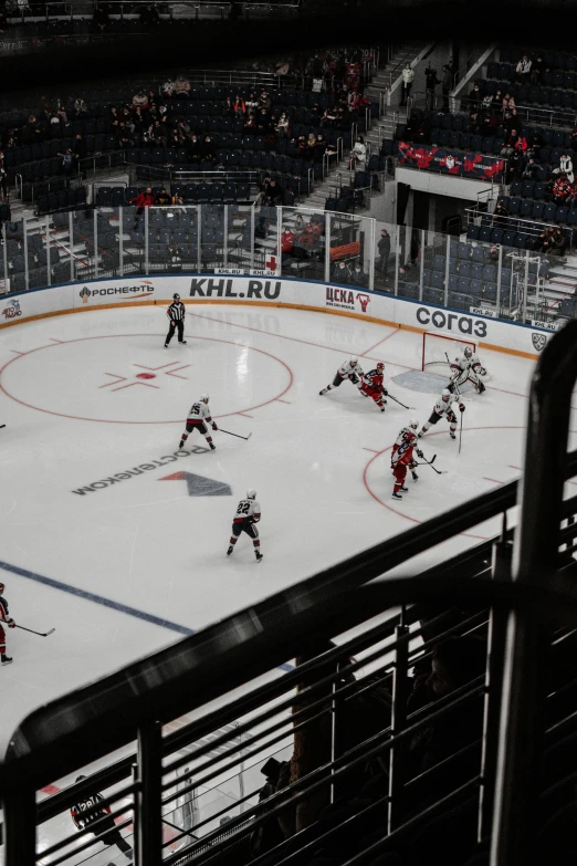 an ice hockey game with players playing in a rink