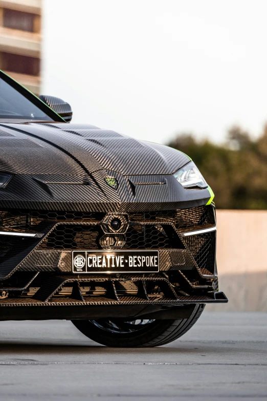 the side of a car in front of some buildings