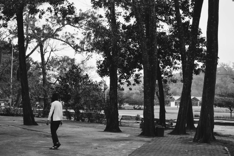 a black and white po of a man riding a skateboard