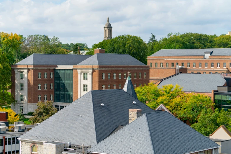 a large building in the distance with a clock tower on top