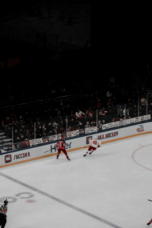 hockey players on an ice rink during a game