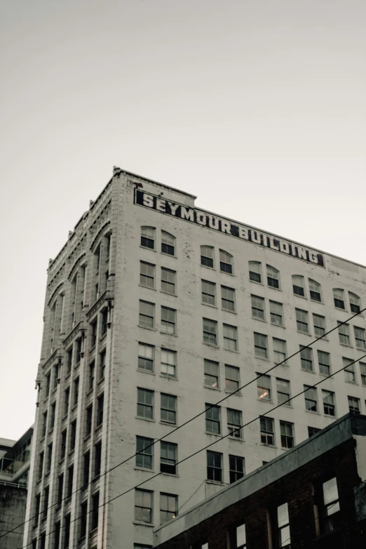 an old skyscr with a big white building on it