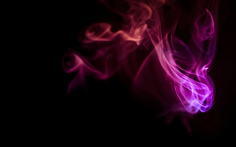 purple smoke swirling up against a black background