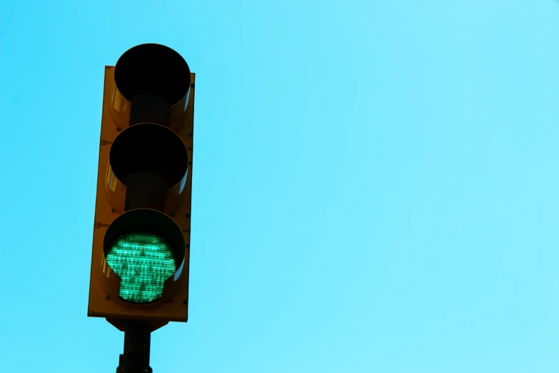a traffic signal that is green with some green light