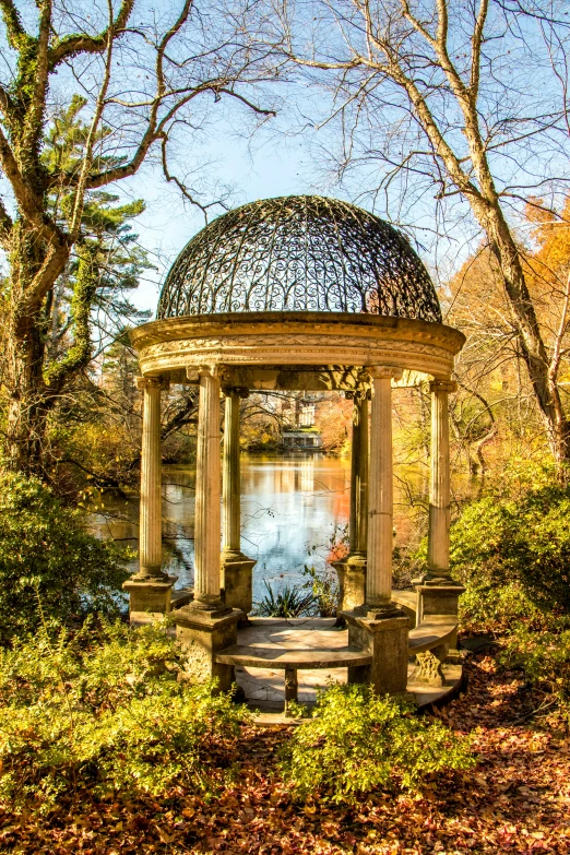 an ornate gazebo in the middle of a park