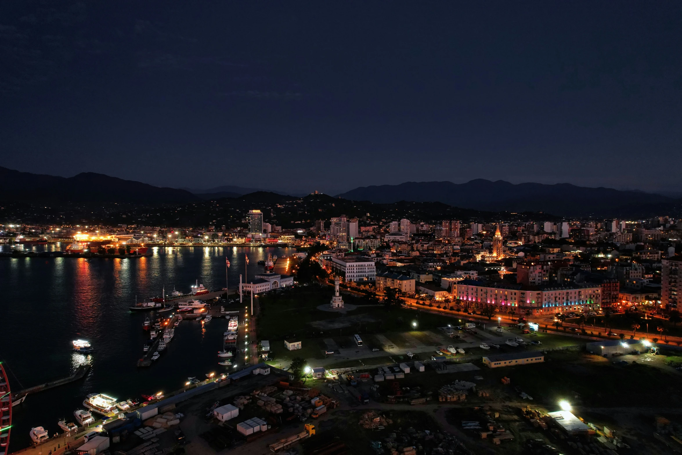 a picture from the air of city lights and docks