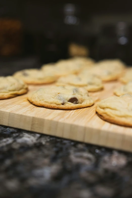 a wood board with cookies arranged on it