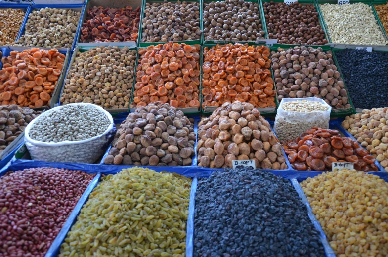 a variety of nuts and rice in baskets