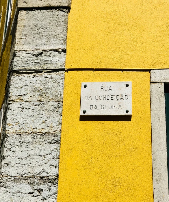 a sign on a wall near a window
