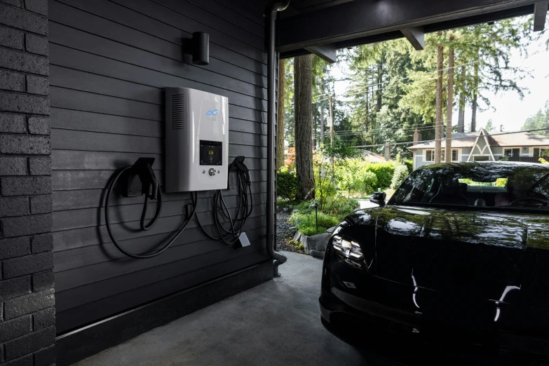 an electric car plugged into a power outlet