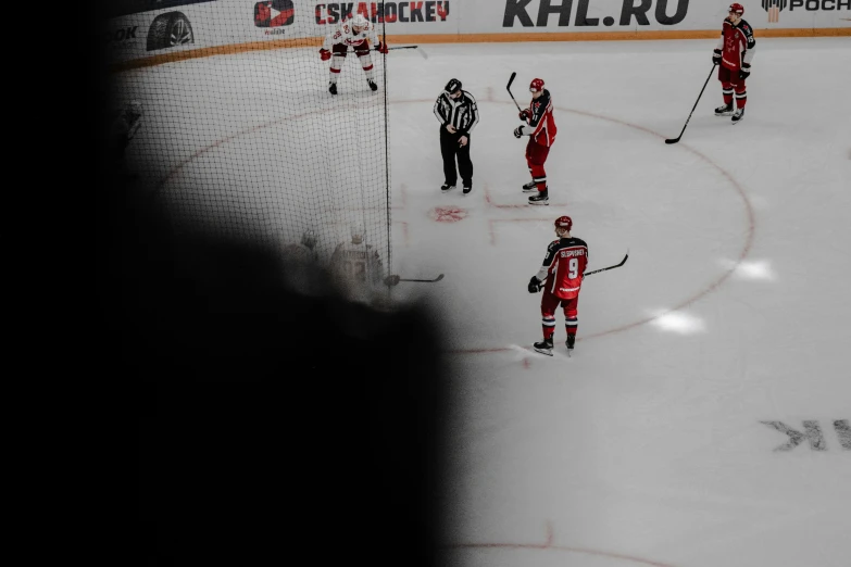 an image of ice hockey players on the ice