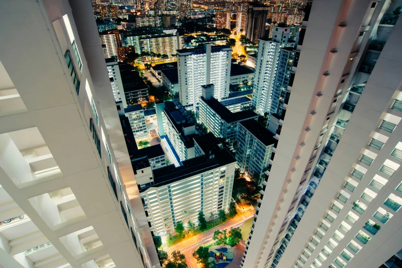 city buildings at night from an aerial view