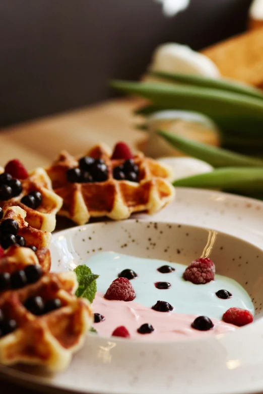 a plate topped with waffles covered in jelly