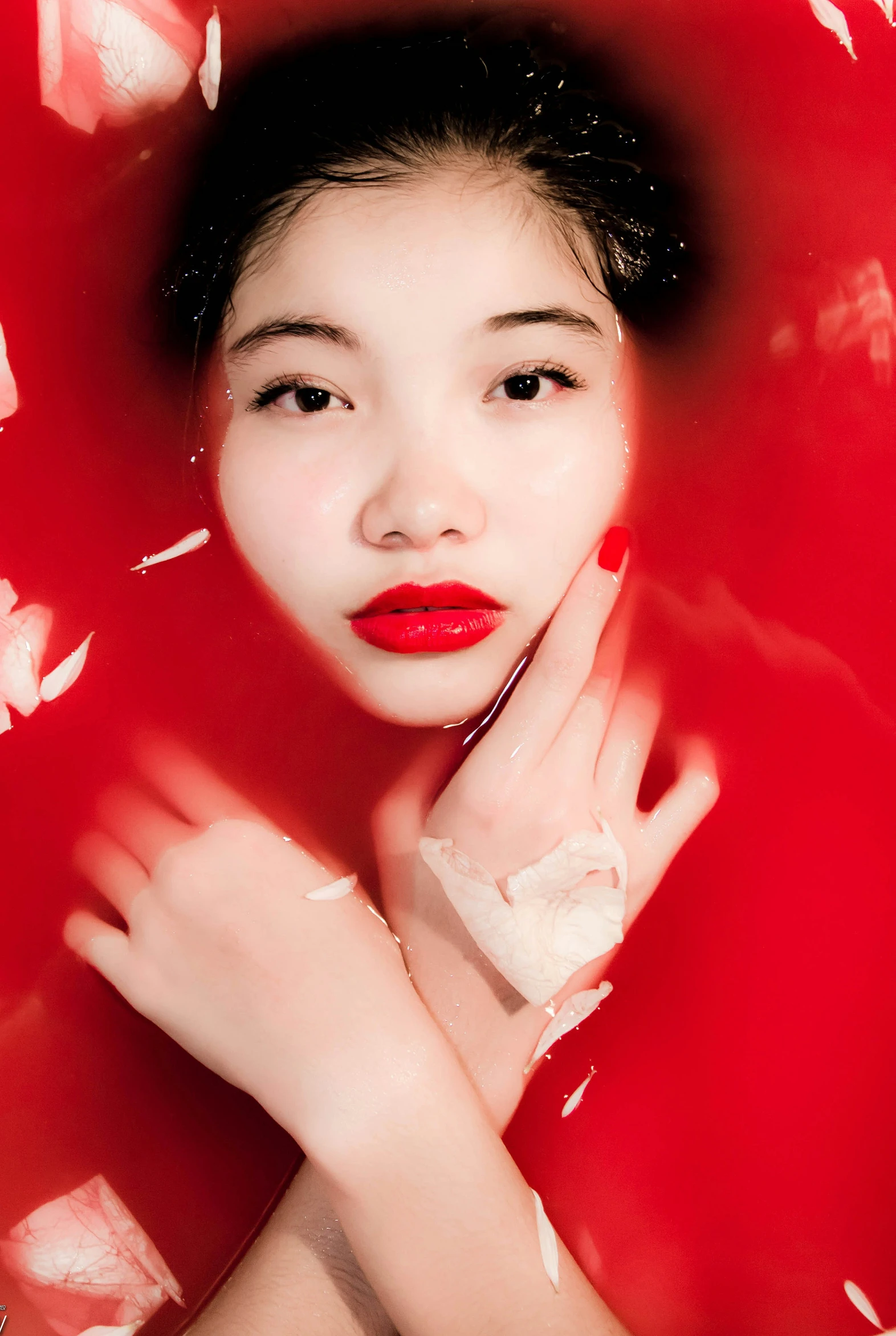 an oriental woman in red and white clothing