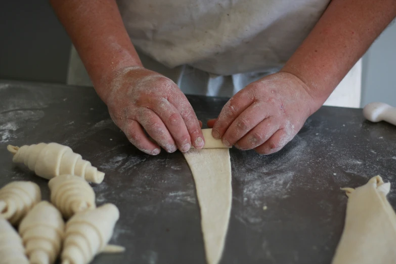 hands on  board preparing food items in kitchen