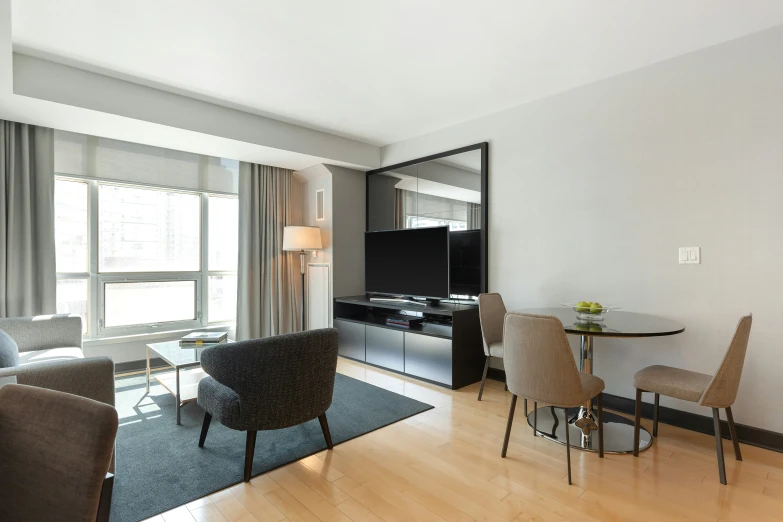 a living room and dining area in one of the houses