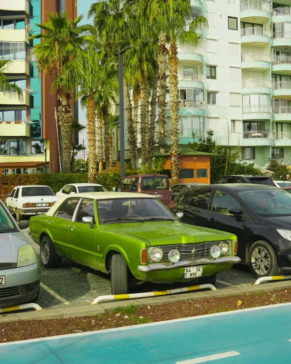 an urban parking lot with several parked cars