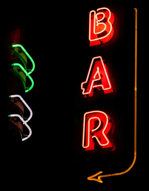 a close up of an illuminated sign on a pole