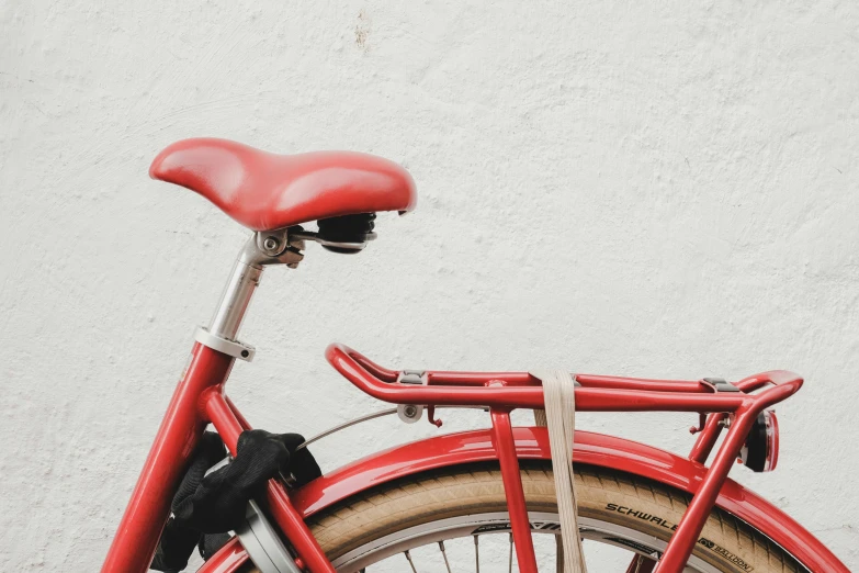 a bicycle that is standing against the wall