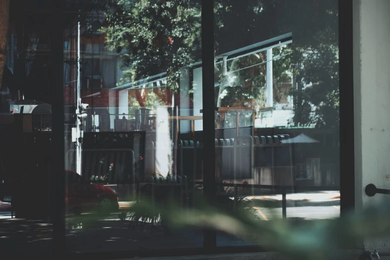 the reflection of a building through a window